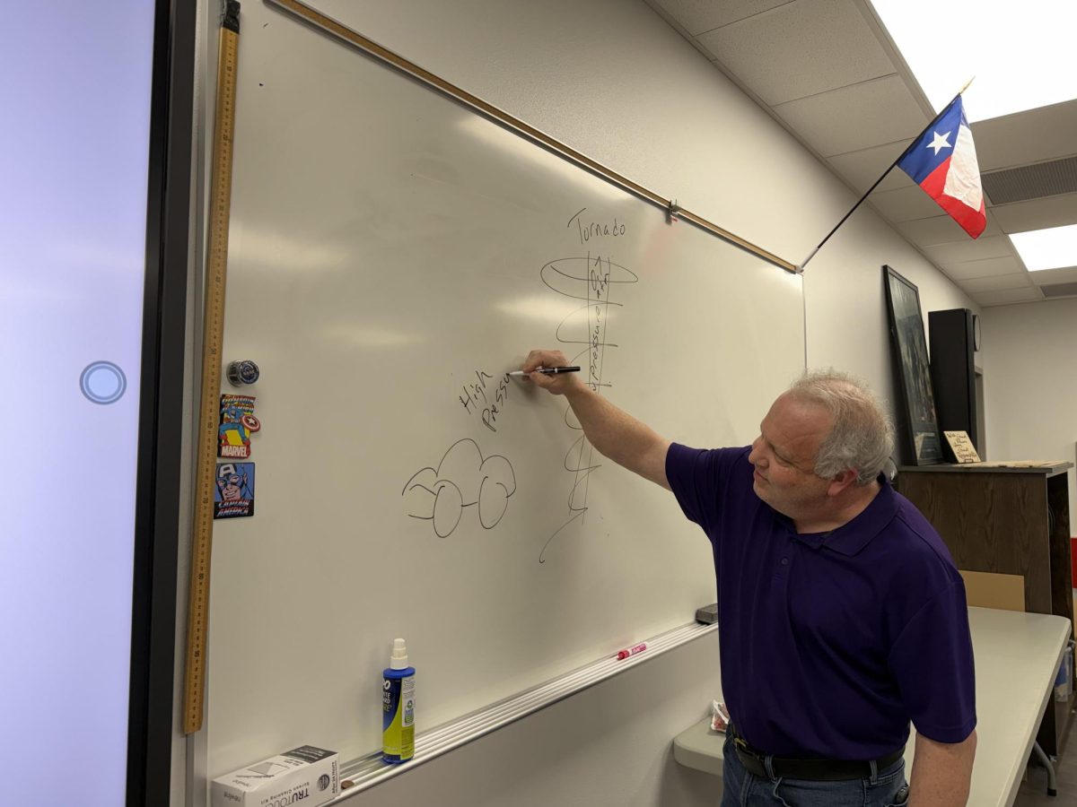 Illustrating a tornado and a car, Mr. Jerry Grizzle teaches his students about high pressure and low pressure. Grizzle has been teaching for thirty years. Grizzle is the only AP Physics teacher.